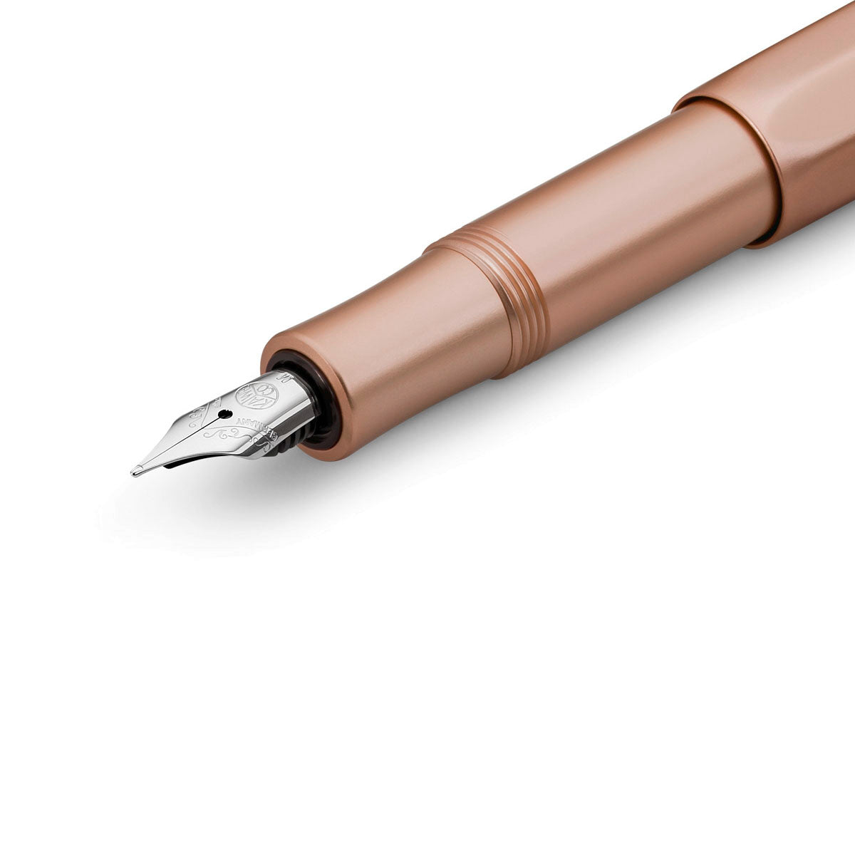 Fountain pens front section, showing silver nib and pink gold base.