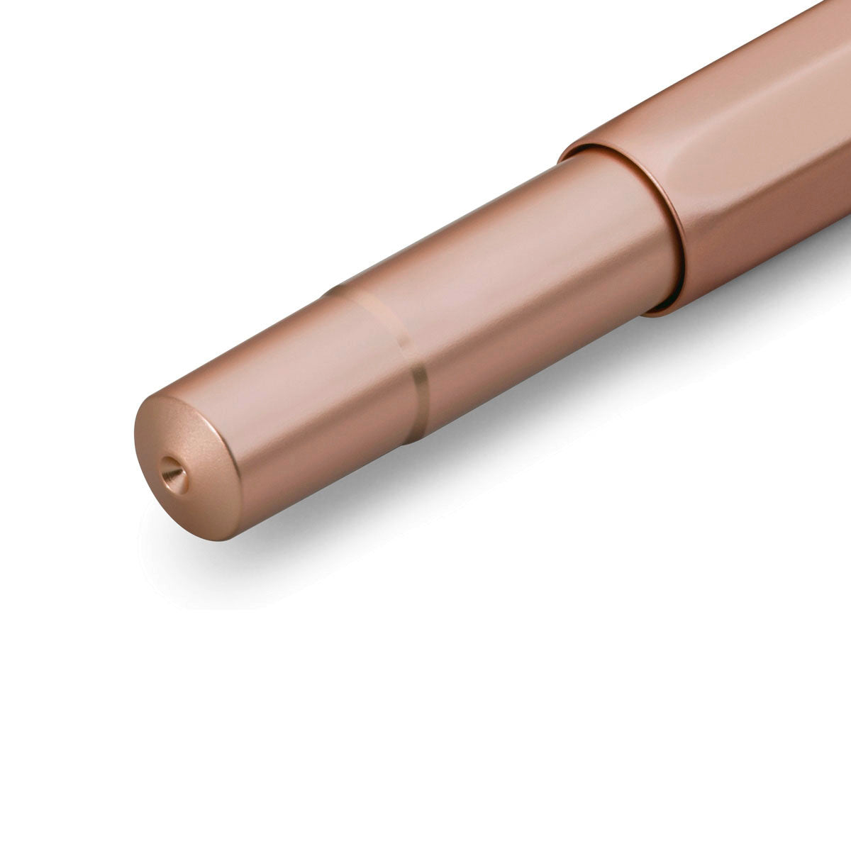 Lower section of a pink-gold pen from close view.