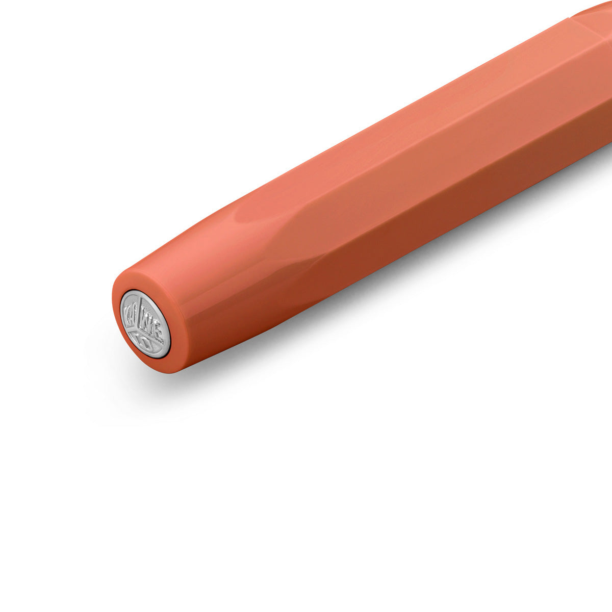 Red fountain pen cap.