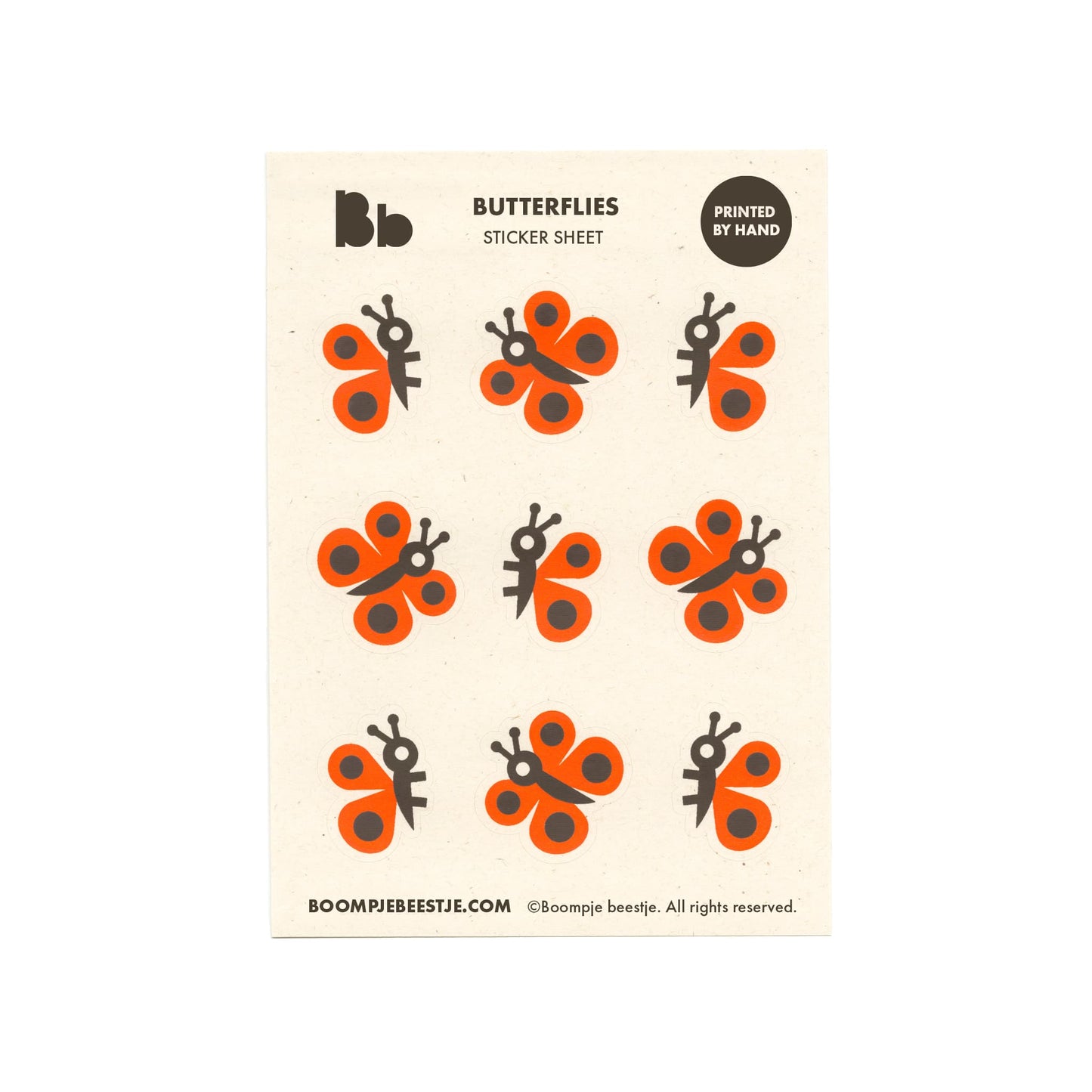 Butterfly sticker sheet with orange and black designs on recycled paper.