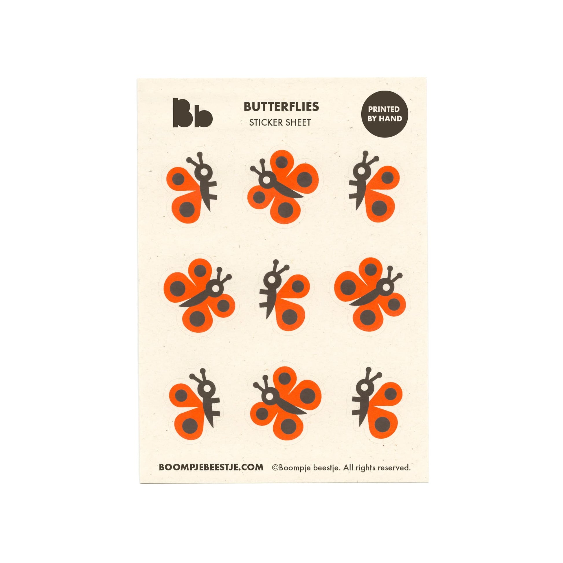 Butterfly sticker sheet with orange and black designs on recycled paper.