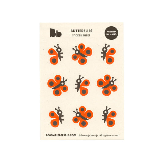 Butterfly sticker sheet with orange and black designs on recycled paper.
