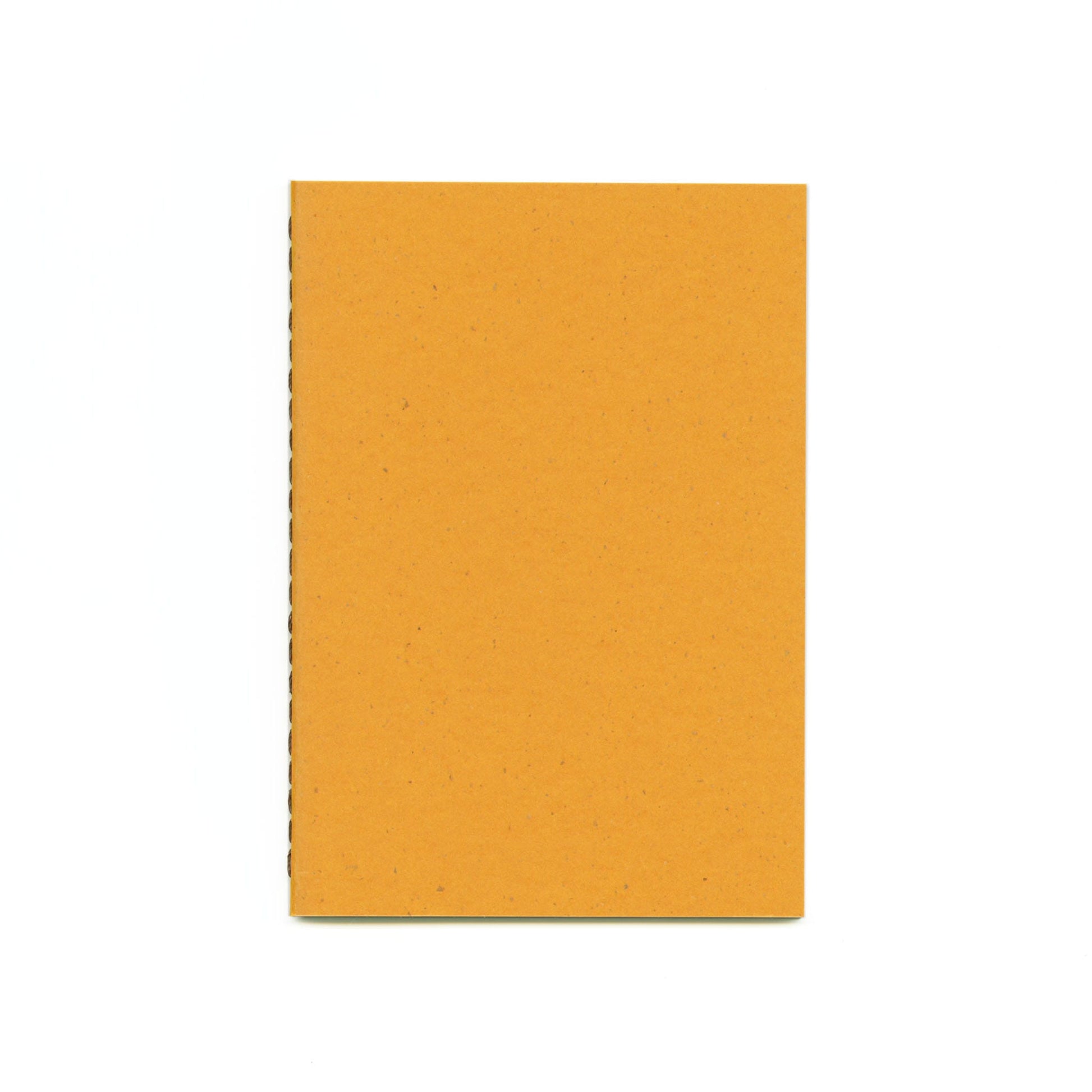 Yellow notebook with brown thread stitched spine.