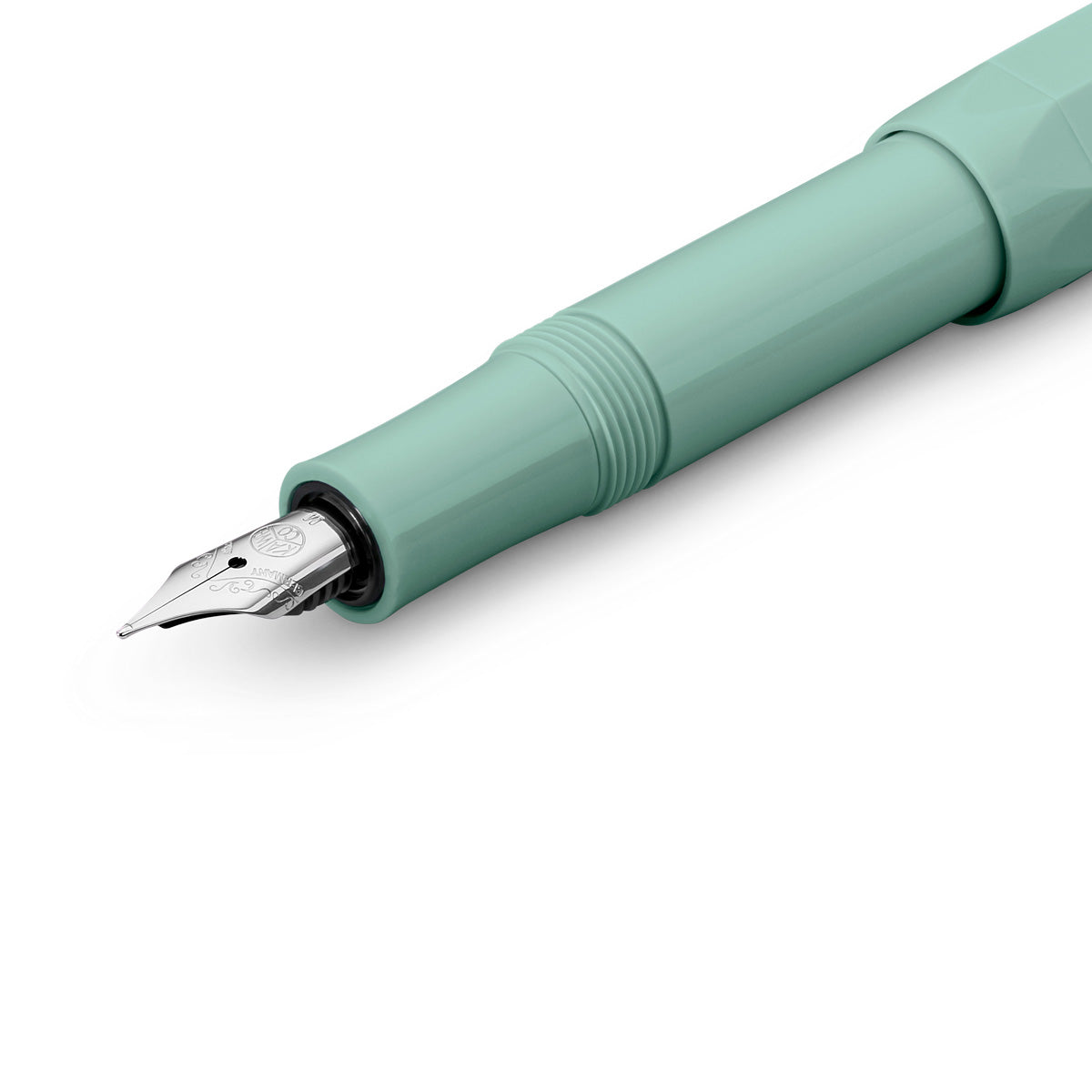 Silver medium nib on a green fountain pen