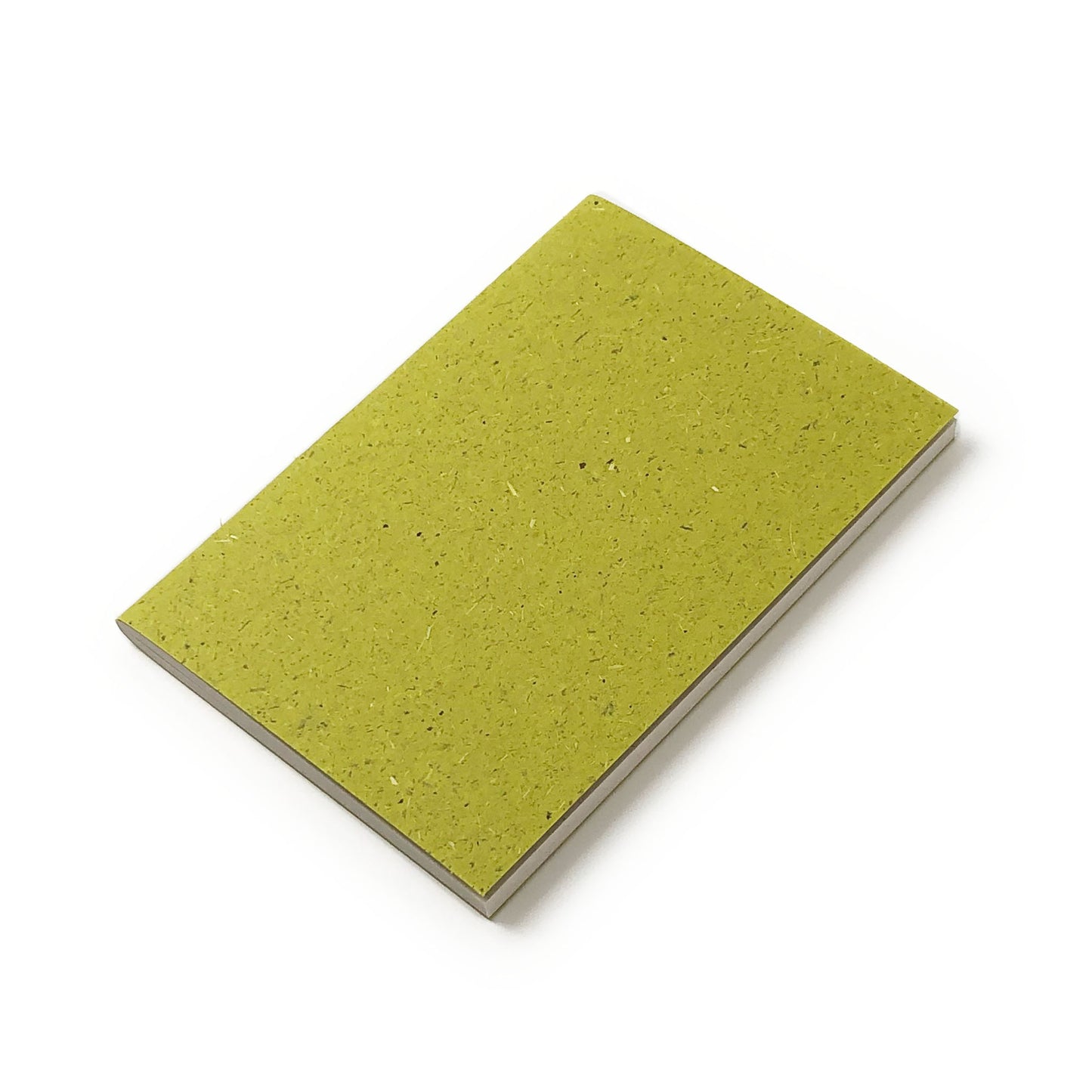 Green notebook with grass-textured cover and blank pages.