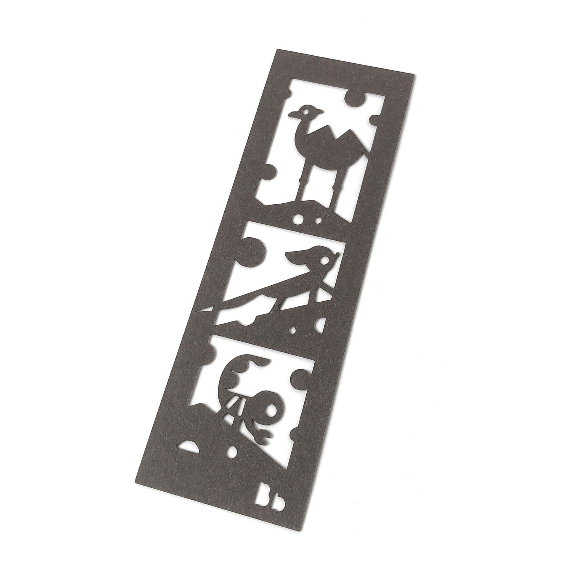 Paper bookmark with a camel, fennec fox and scorpion cut art design.