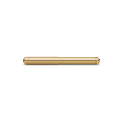 Closed gold-tone metallic pen resting on a white background.