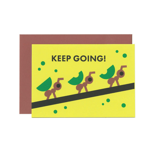 Greeting card with text Keep going! and art of ants carrying leaves in a row on a branch. An envelope is placed behind it.