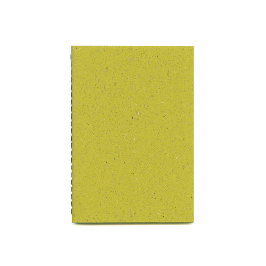 On a white background, there is a green textured notebook with a spine stitched with brown thread.