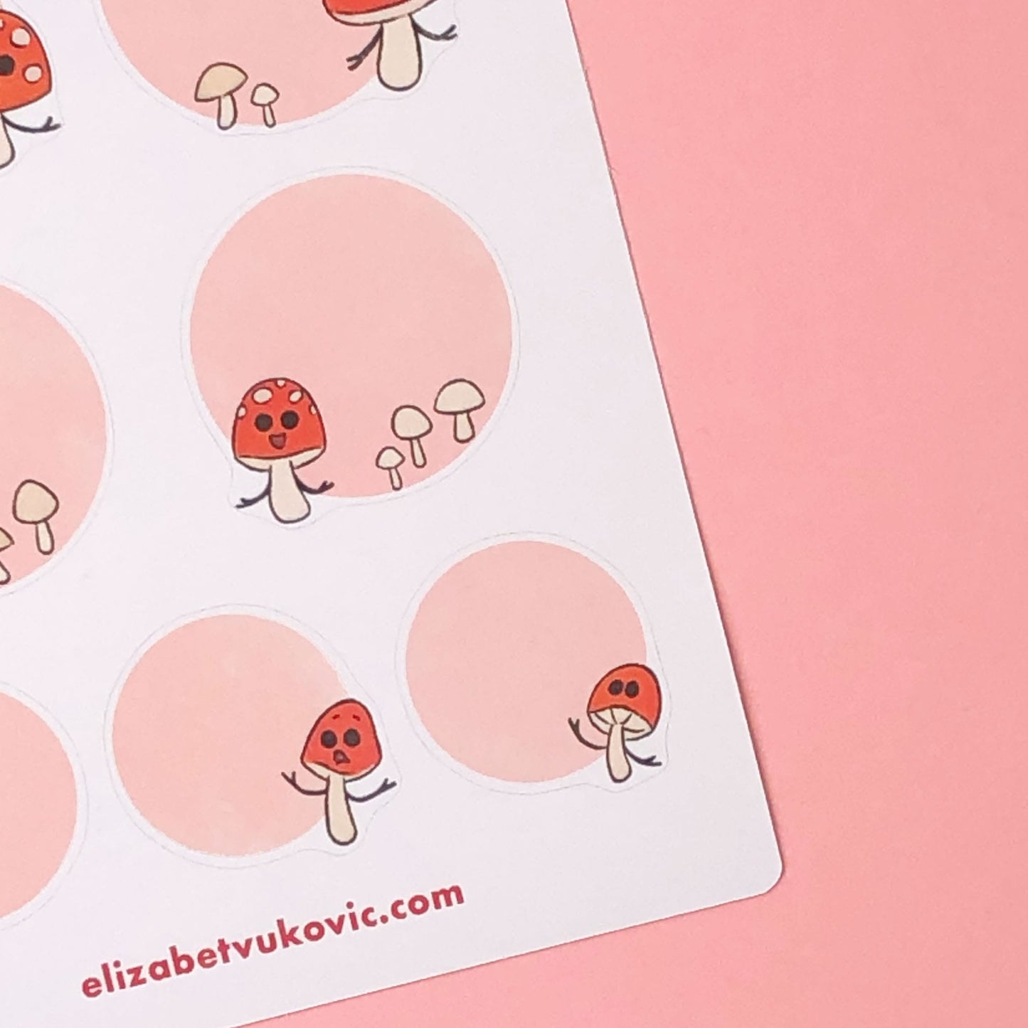 Pink round whimsical mushroom stickers.