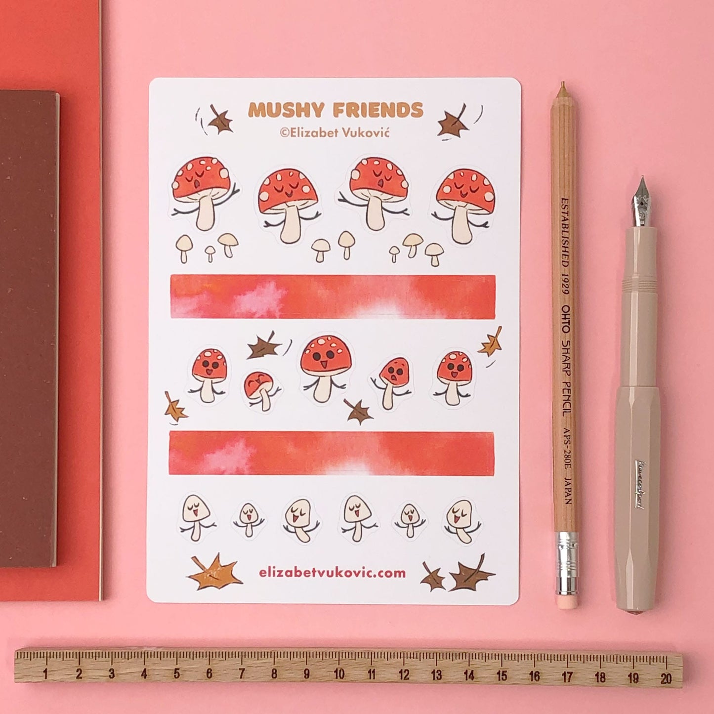 Cute mushroom stickers and washi tape beside stationery.