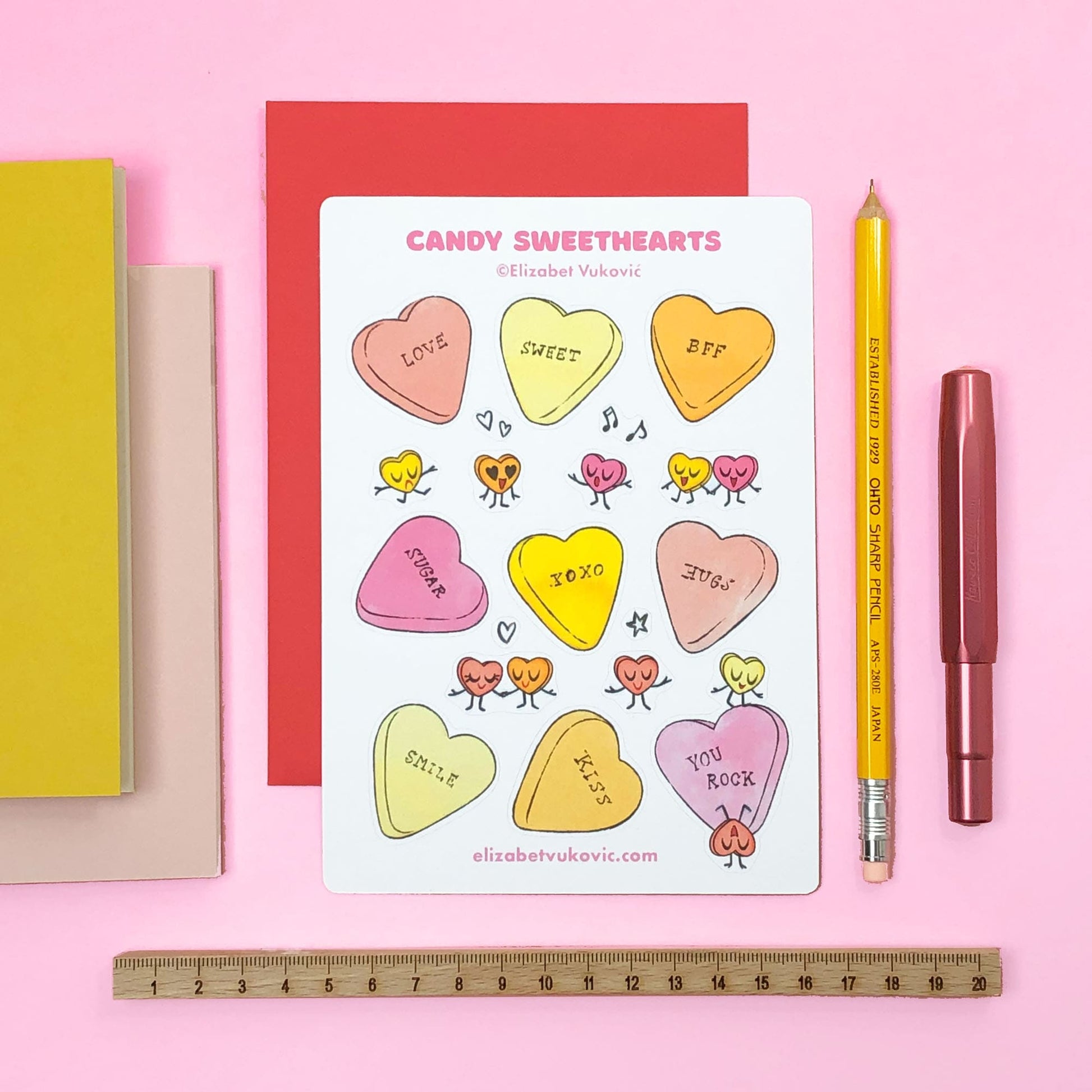 Candy Hearts Valentines Sticker sheet beside pens and notebooks.