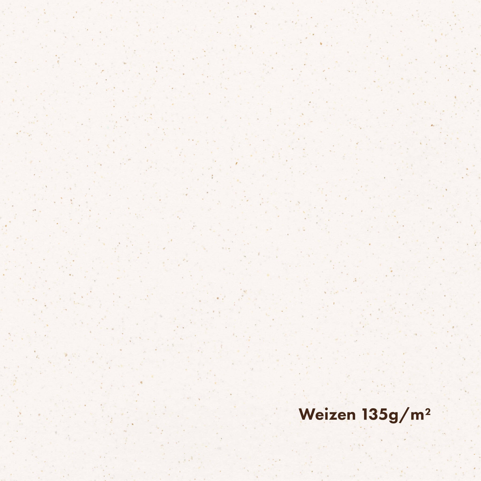 Close-up of white-toned pulp paper with noticeable brown speckles, with the text 'Weizen 135g/m2' printed on it.