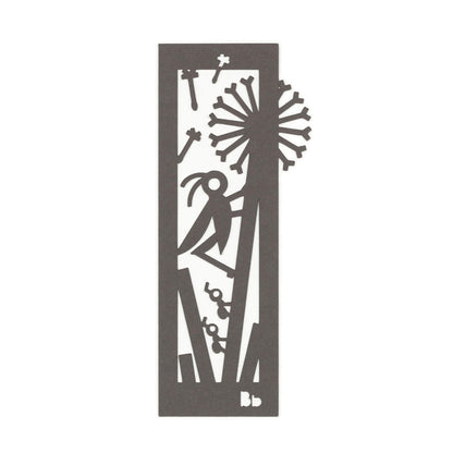 A dark brown paper bookmark with cut-outs of a cricket and two ants on a dandelion surrounded by blades of grass on a white background.