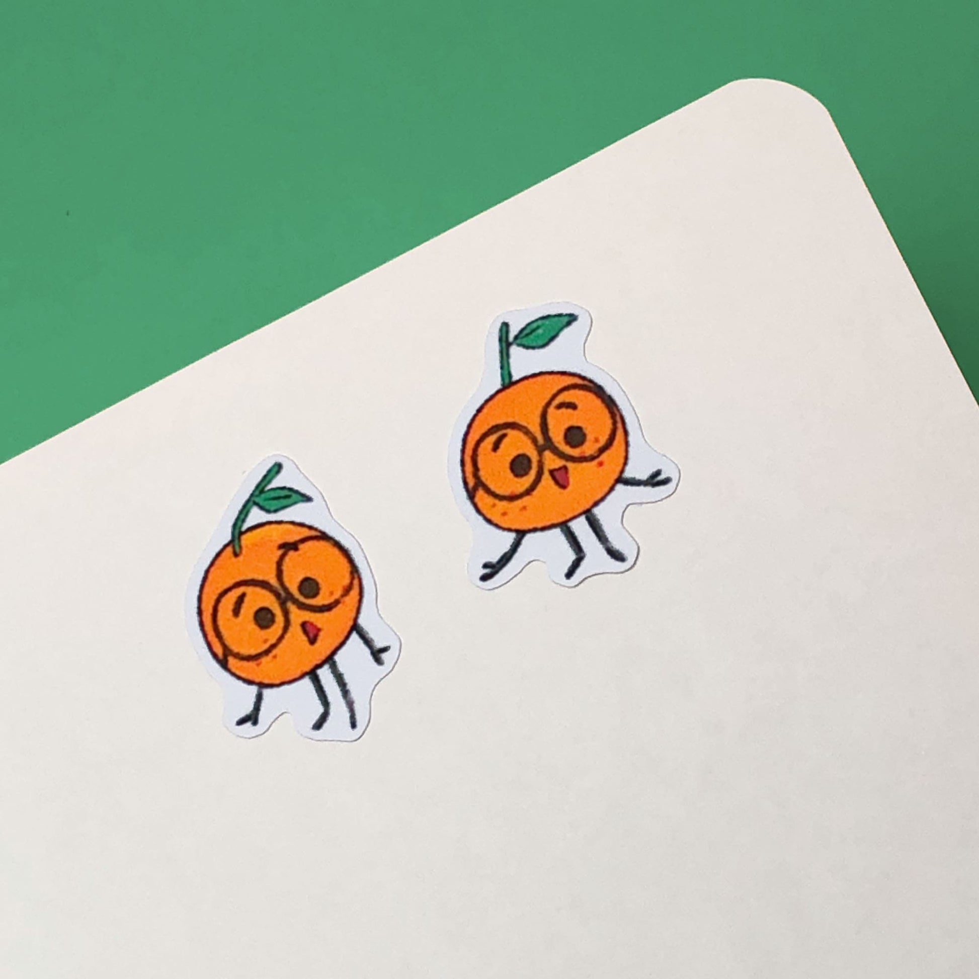 Oranges stickers on a journal.