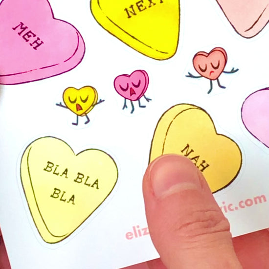 Candy conversation heart sticker on a journal.