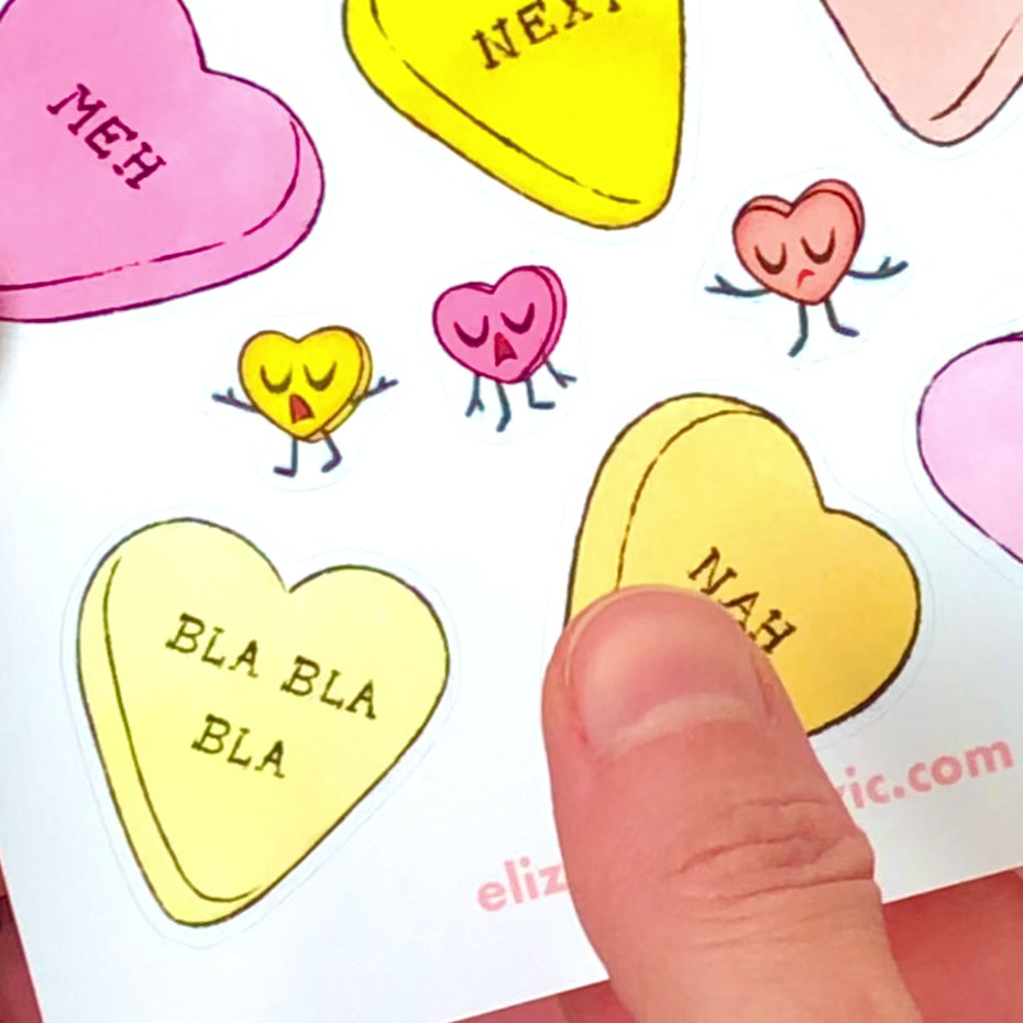 Candy conversation heart sticker on a journal.