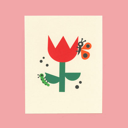 An art print of an illustration featuring a caterpillar and butterfly on a tulip, displayed on a pink background.
