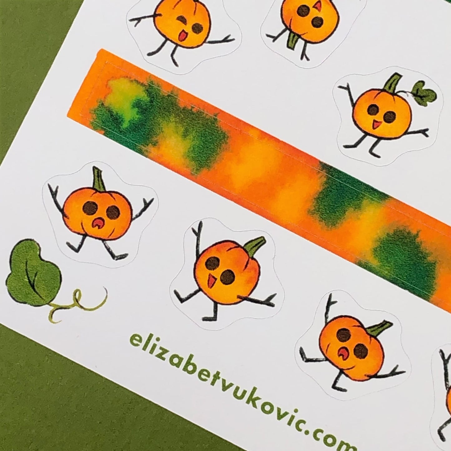 Cute orange pumpkins and washi tape stickers.