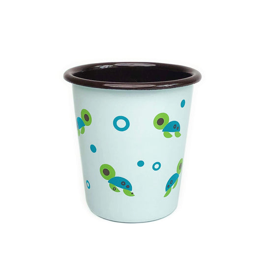 Light blue tumbler with dark-brown rim with illustrations of small green-blue sea turtles surrounded by dots, on a white background.
